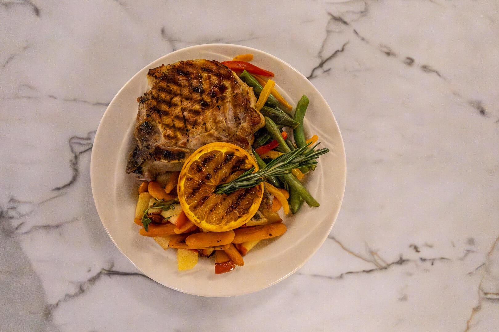 Grilled Pork Chop with Roasted Vegetables and Rosemary at an Independent Living Community