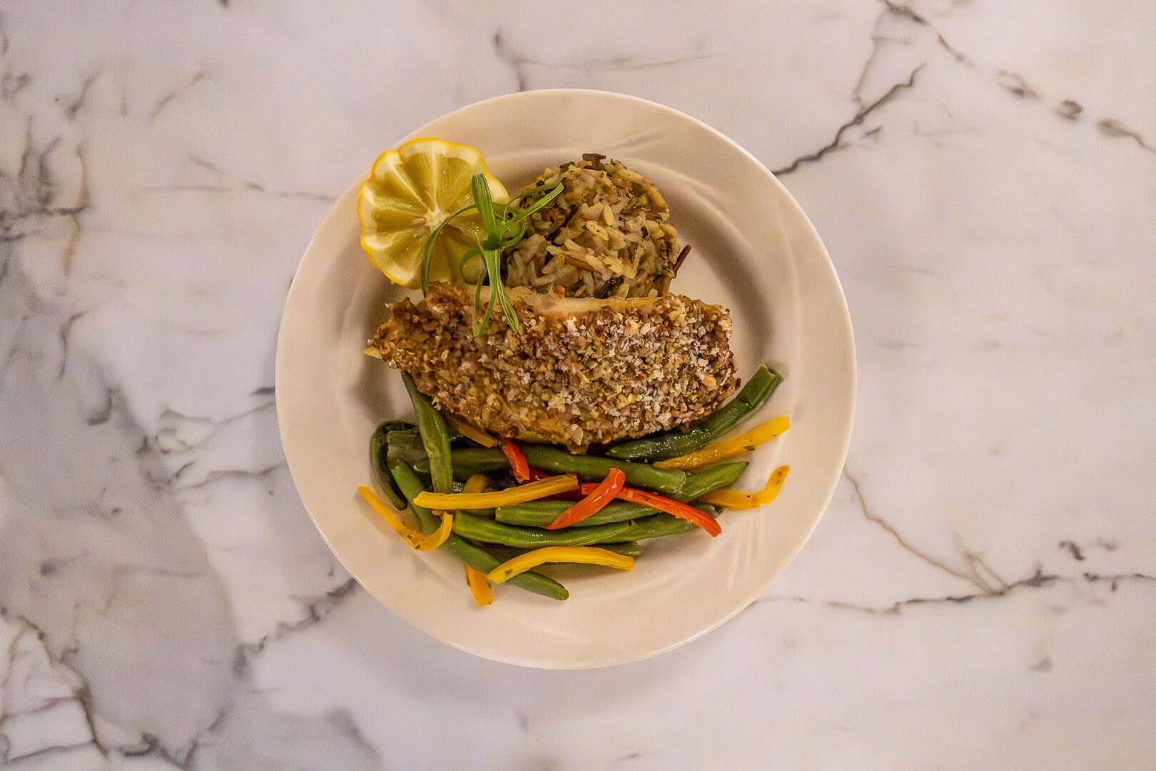 Herb-Crusted Fish Fillet with Colorful Vegetables Served at an Independent Living Facility