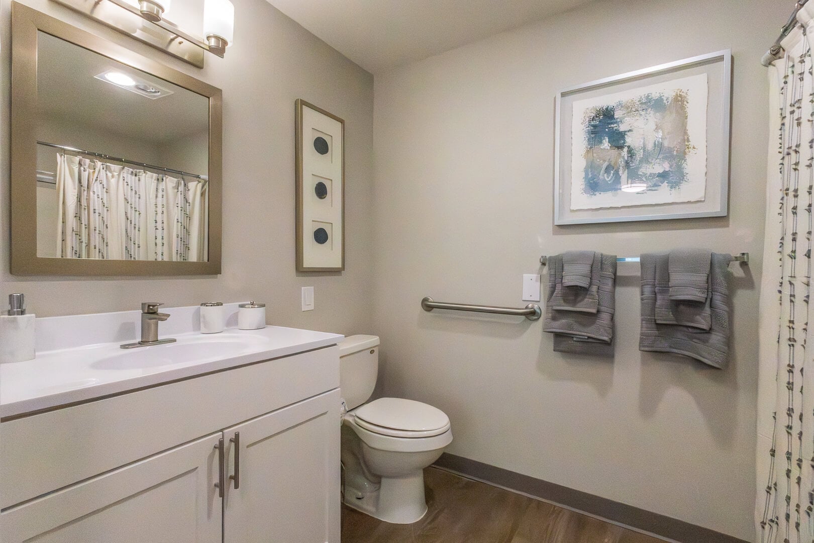 Accessible Private Bathroom with Grab Bar and Vanity at an Independent Living Community