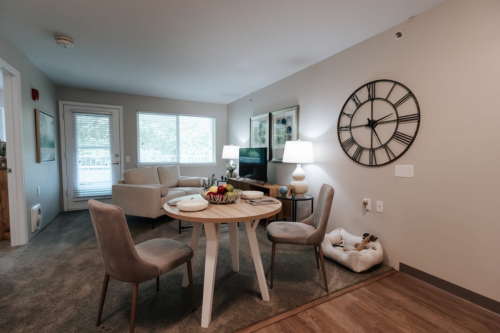 Sun-Filled Resident Apartment with Dining Table and Living Space at an Independent Living Facility