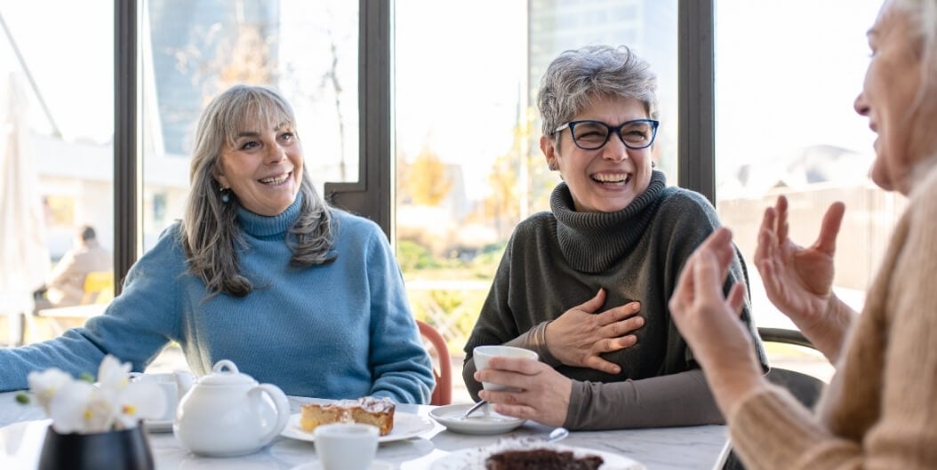 Elderly Women Chatting Over Tea at Independent Living Facility